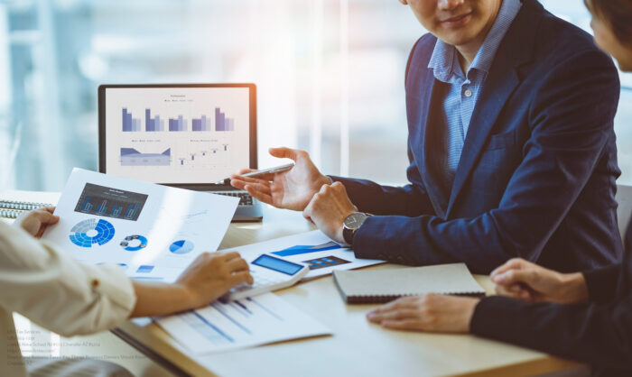 A Male Business Consultant Describes A Marketing Plan To Set Bus